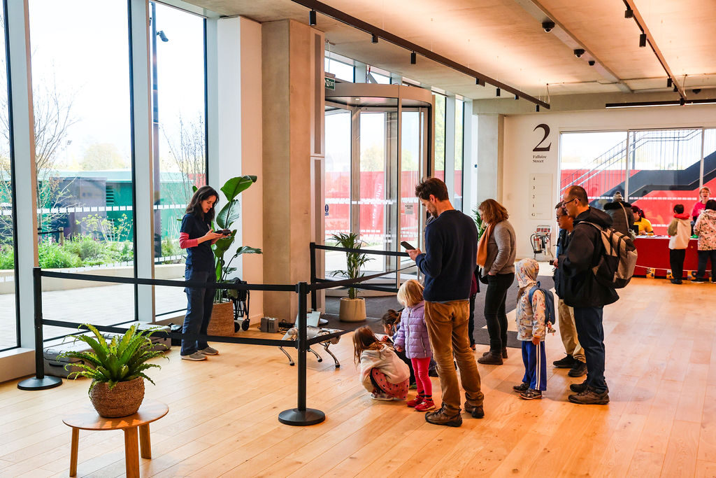 Families gathered around the public artwork at Oxford North