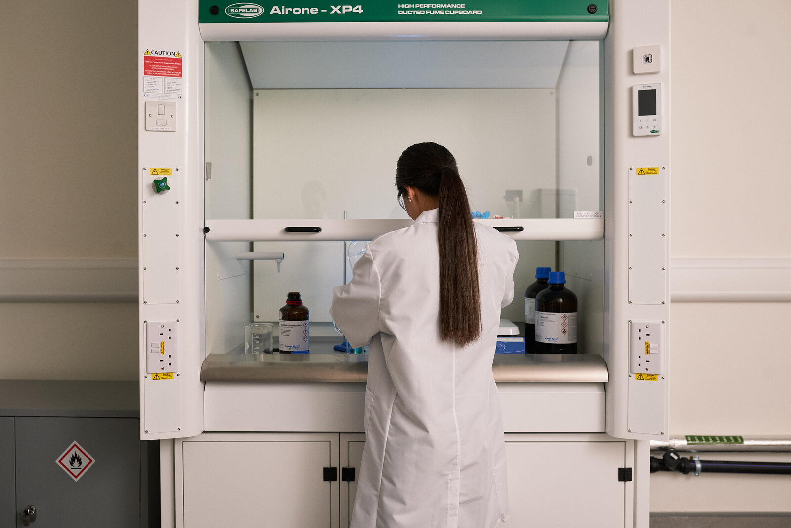 Working at a fume hood in an Oxford North laboratory
